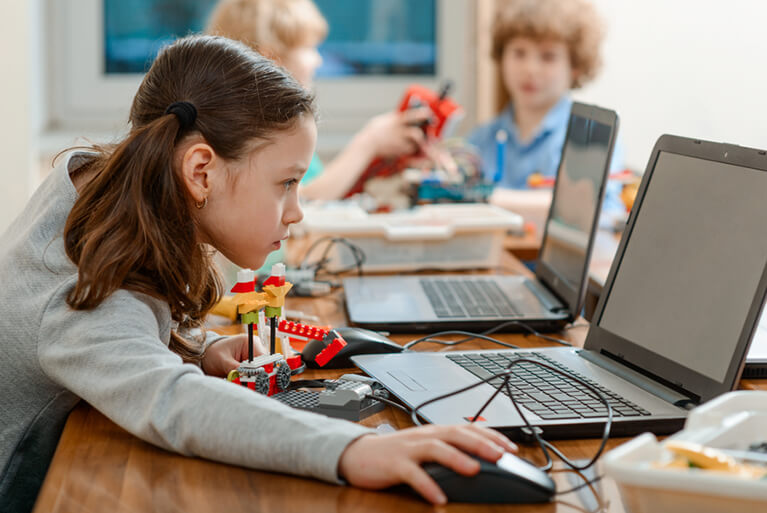 Girl using mathematics for a STEM project