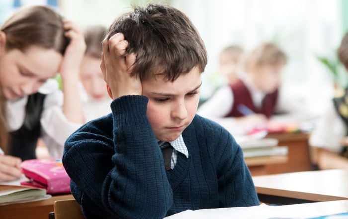 child looking anxious doing mathematics