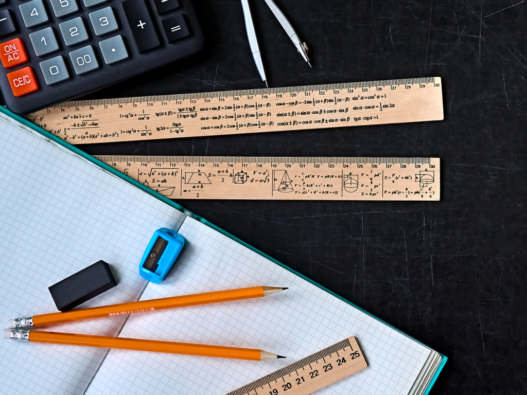 rulers pencils calculator and a workbook