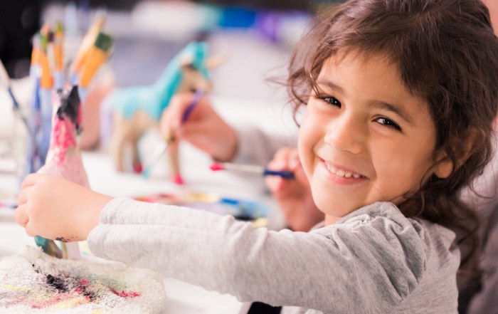 girl painting a craft project