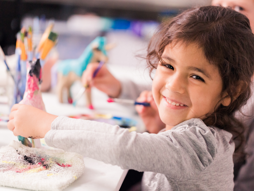 girl painting a craft project