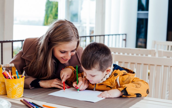 mother drawing with her young son