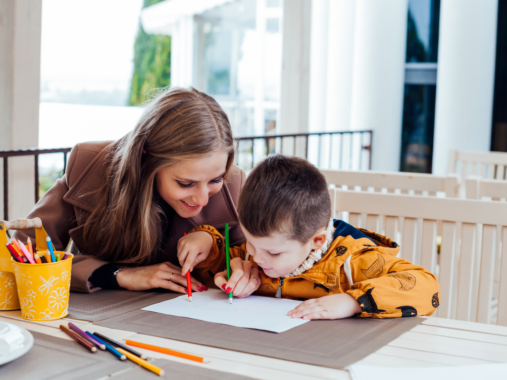 mother drawing with her young son