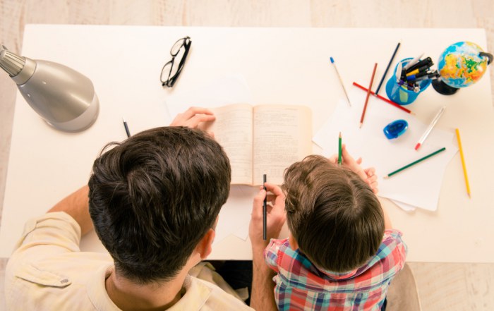 father helps son with homework