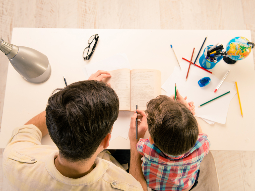 father helps son with homework