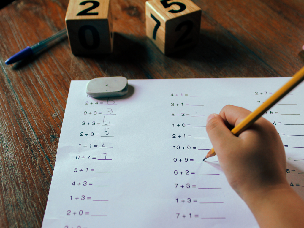 student doing first grade mathematics homework