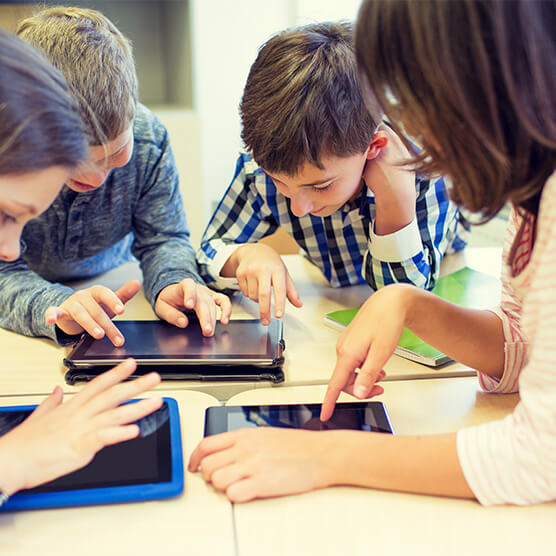 Testimonial pic 3 Excited students working with Mathletics on tablets
